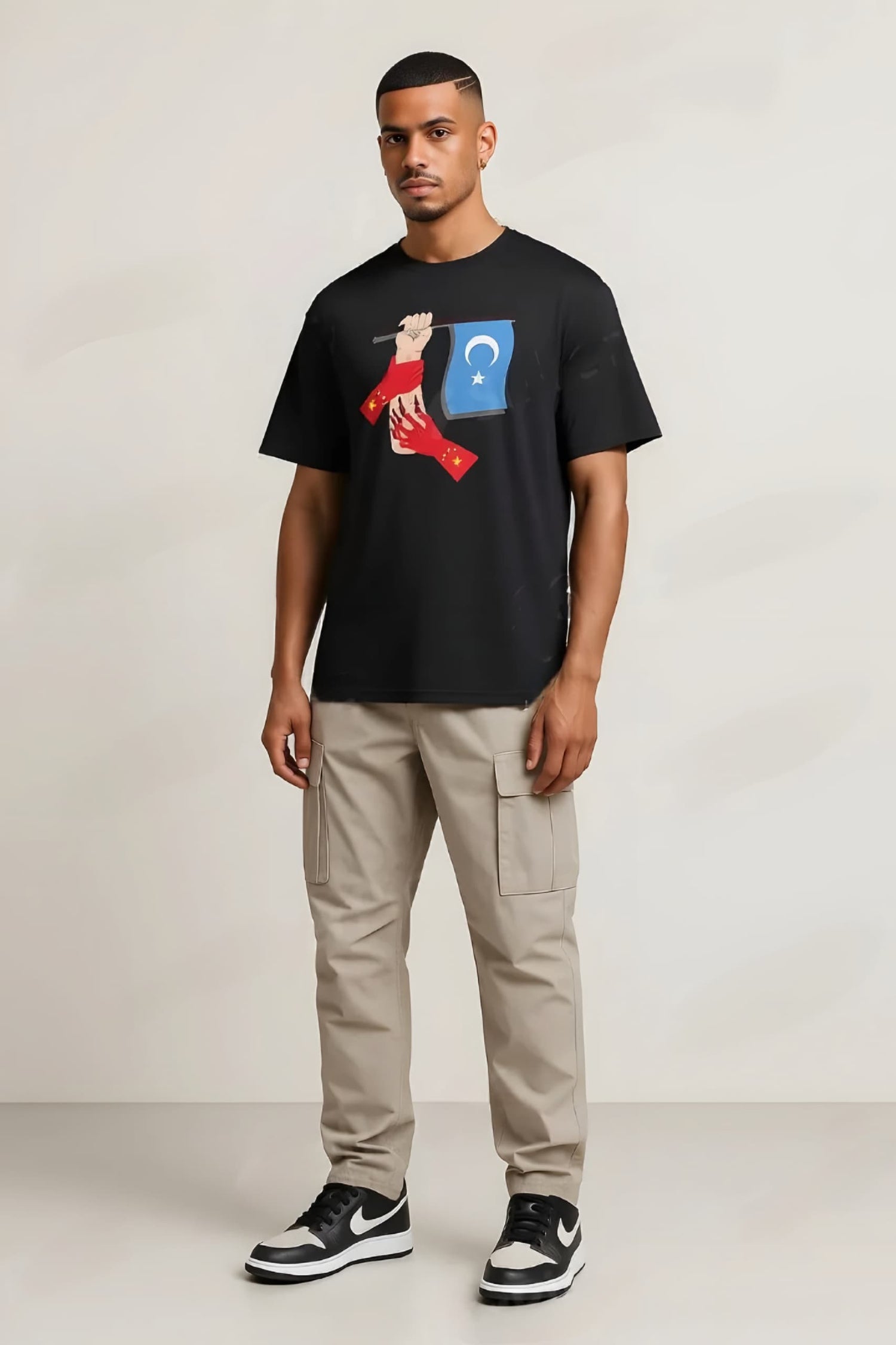 Front view of Uyghur Rise shirt with bold “Stand With Uyghurs” text

Model wearing Uyghur shirt during peaceful rally or street setting