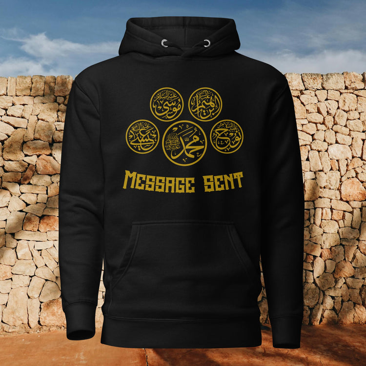 Model wearing Islamic hoodie with Quran-inspired design in urban setting